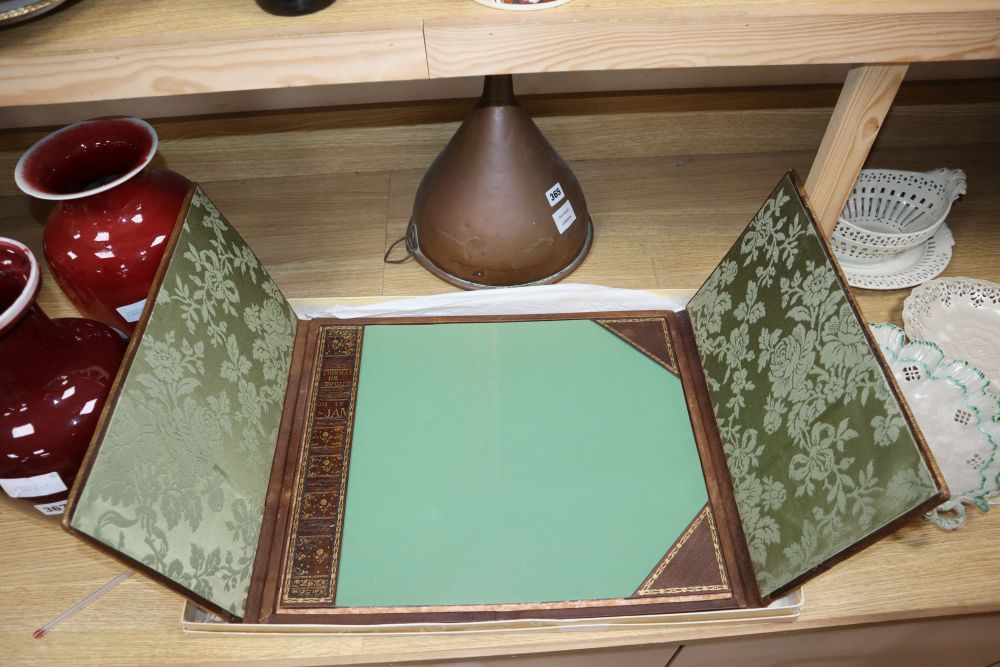 A French gilt tooled and brown leather double folding desk blotter, with retailers box for Armorial Palais de Congres, Paris